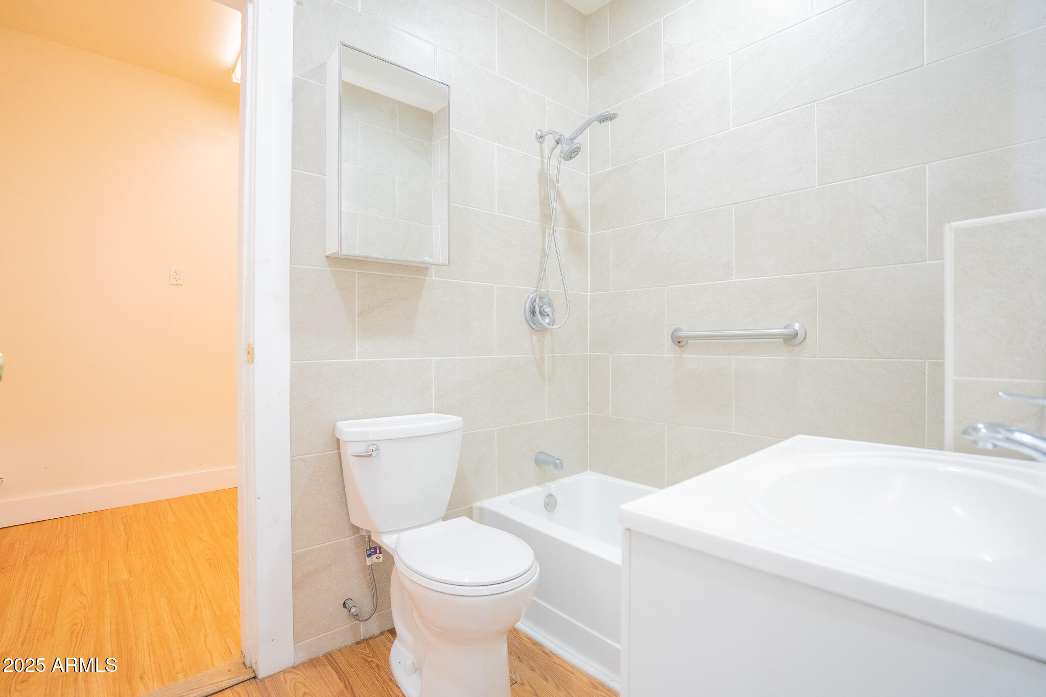 1001 East Garfield Street Phoenix, AZ 85006 - Photo 18 of 27 a bathroom with a toilet a sink and a shower