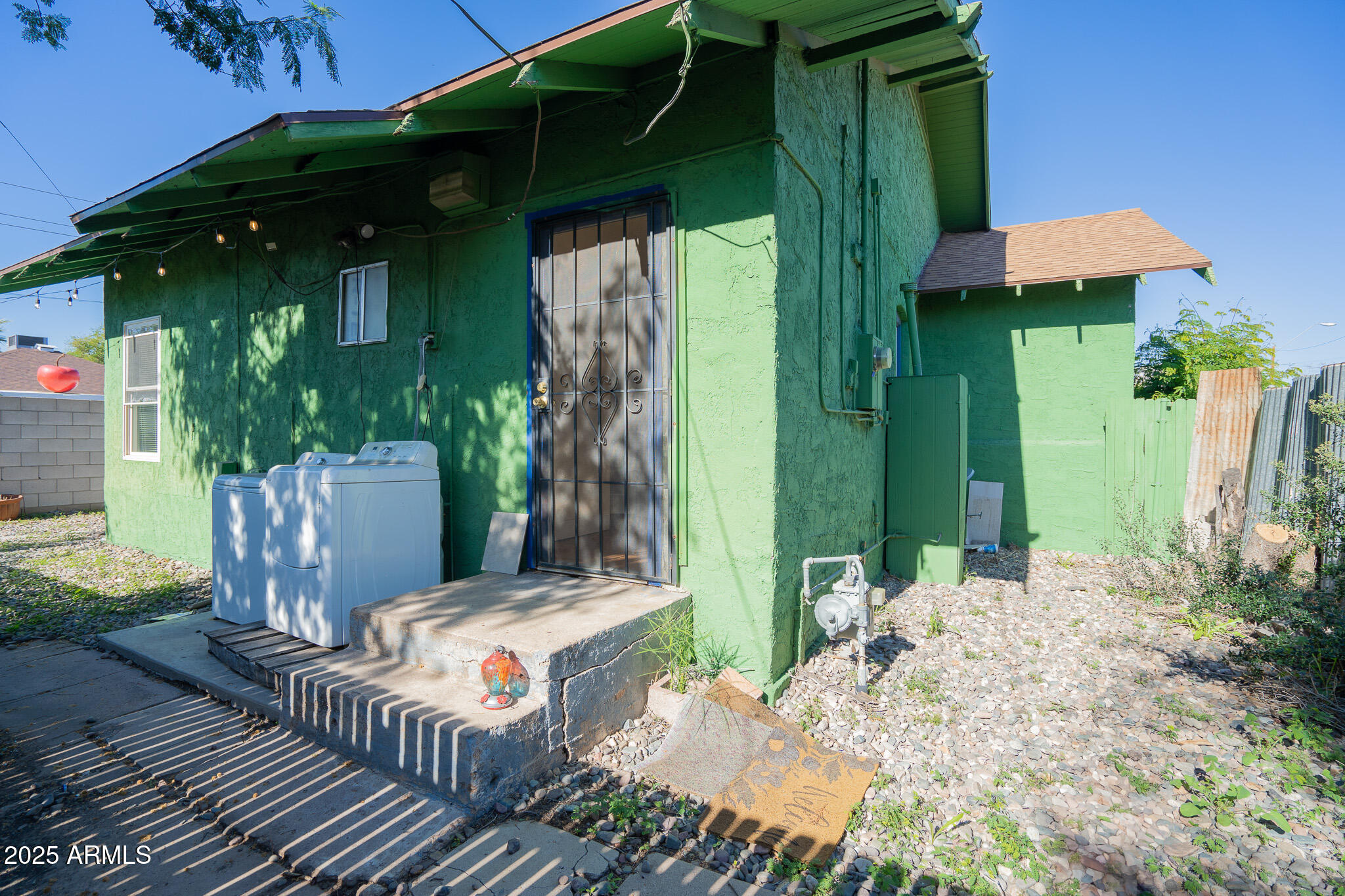 1001 East Garfield Street Phoenix, AZ 85006 - Photo 27 of 27 a view of a porch with furniture and a yard
