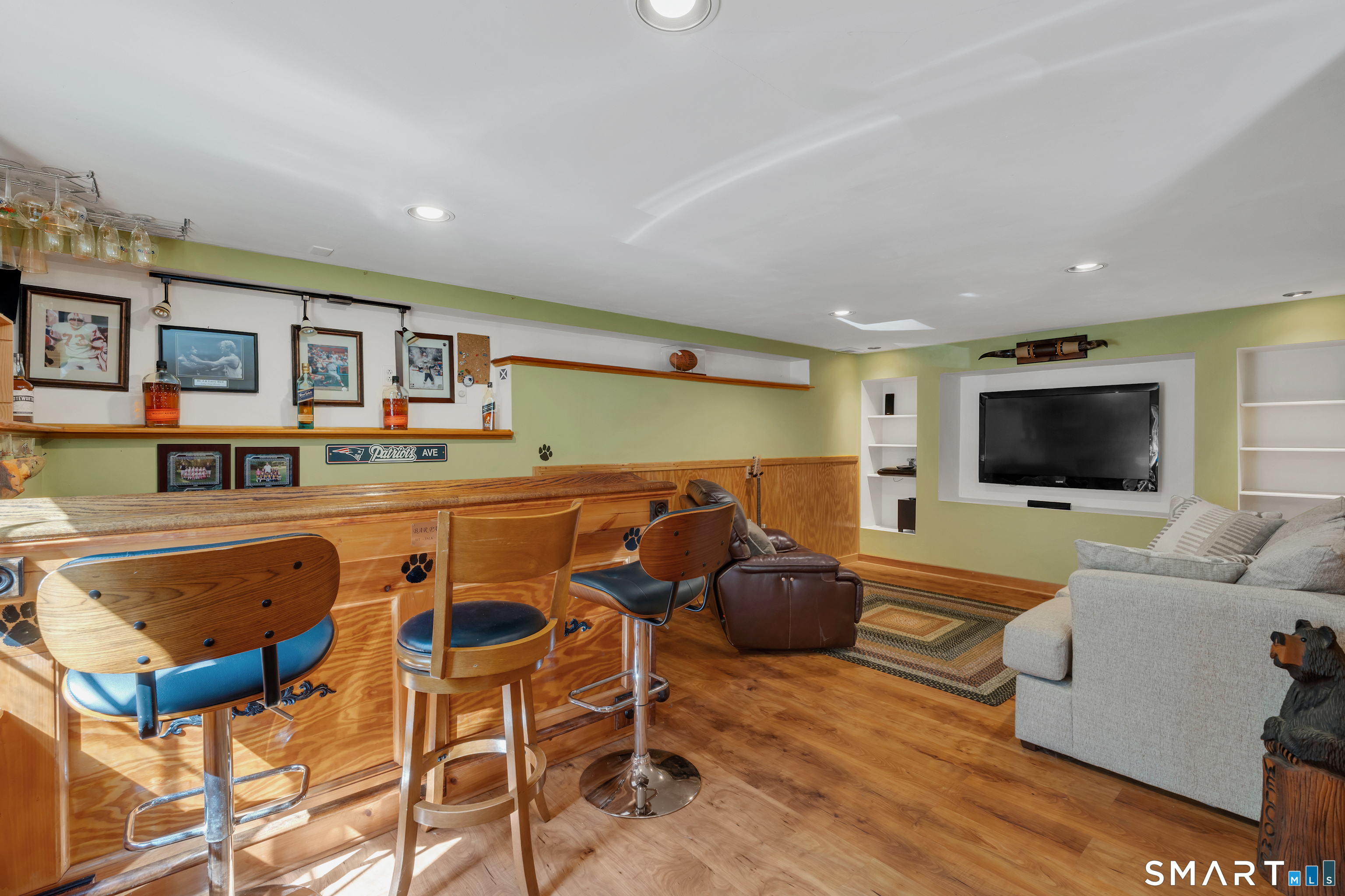 94 Warpas Road Madison, CT 06443 - Photo 17 of 28 Partially finished basement with custom bar