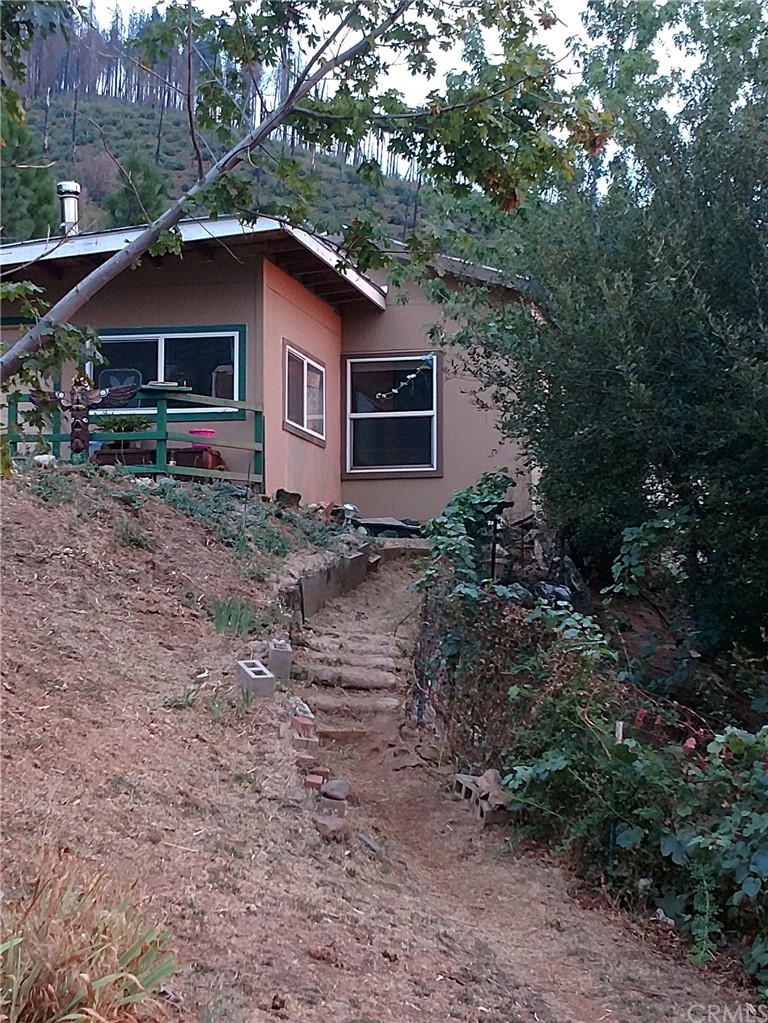 4236 Kakini Road Oroville, CA 95965 - Photo 2 of 36 a house with trees in the background