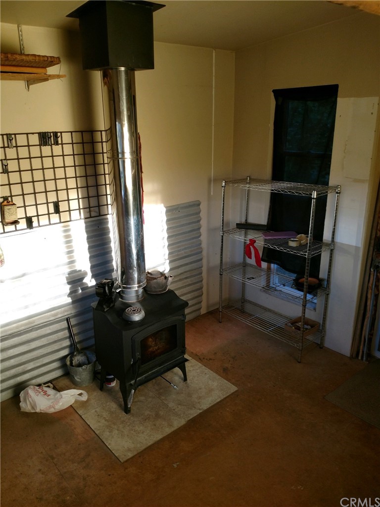 4236 Kakini Road Oroville, CA 95965 - Photo 14 of 36 a living room with furniture and a flat screen tv