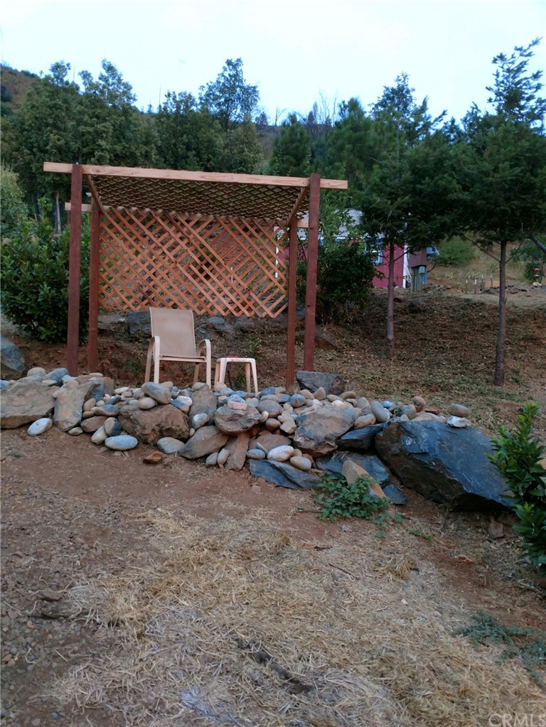 4236 Kakini Road Oroville, CA 95965 - Photo 3 of 36 an outdoor space with furniture and trees