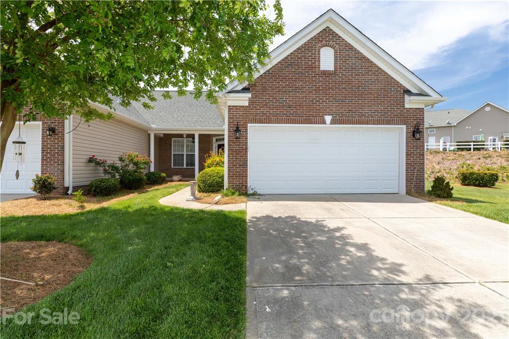 638 Amethyst Circle Fort Mill, SC 29708 - Photo 2 of 38 a front view of a house with a yard and garage