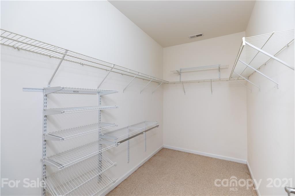 638 Amethyst Circle Fort Mill, SC 29708 - Photo 16 of 38 a view of walk in closet with empty racks