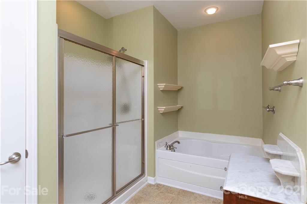 638 Amethyst Circle Fort Mill, SC 29708 - Photo 17 of 38 a bathroom with a bathtub and a shower