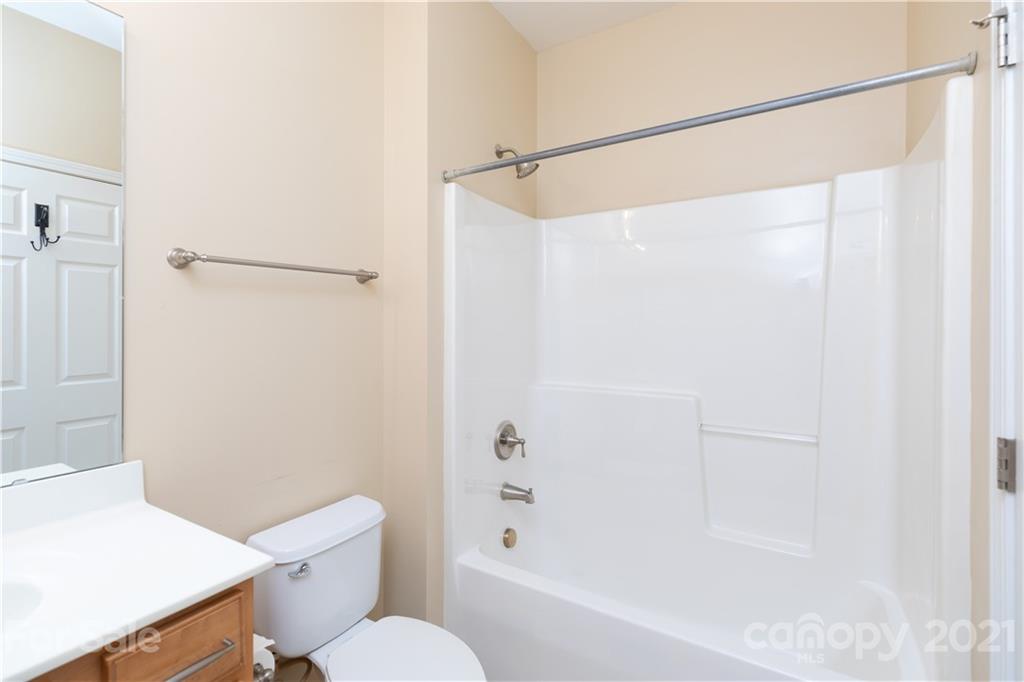 638 Amethyst Circle Fort Mill, SC 29708 - Photo 21 of 38 a white toilet sitting next to a bath tub