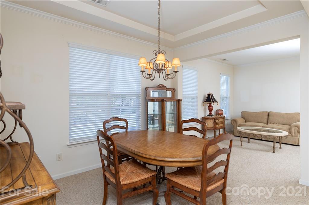 638 Amethyst Circle Fort Mill, SC 29708 - Photo 6 of 38 a view of a dining room with furniture and chandelier