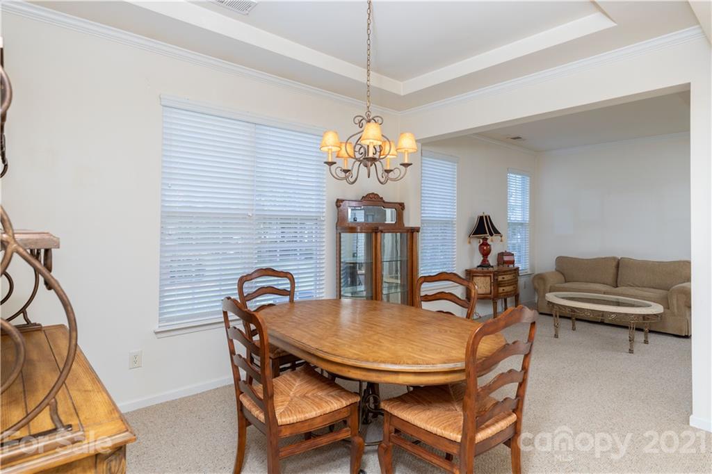 638 Amethyst Circle Fort Mill, SC 29708 - Photo 7 of 38 a dining room with furniture and window