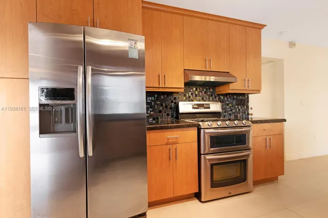 a bathroom with a sink a mirror and a window