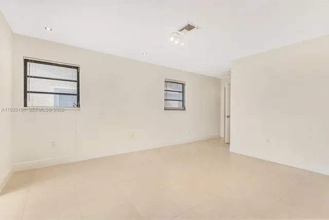 a kitchen with a cabinets and appliances
