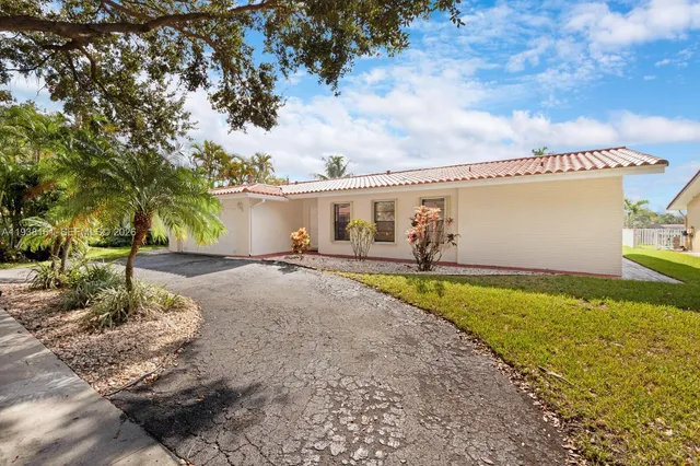 a view of a lake with houses in the back