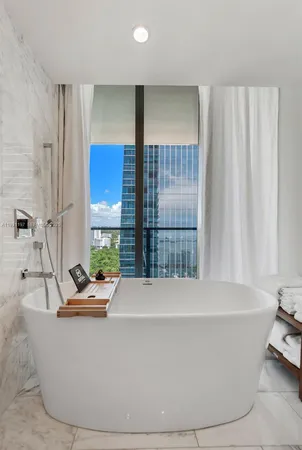 a white bath tub sitting in a bathroom