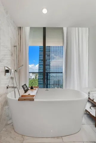 a white bath tub sitting in a bathroom