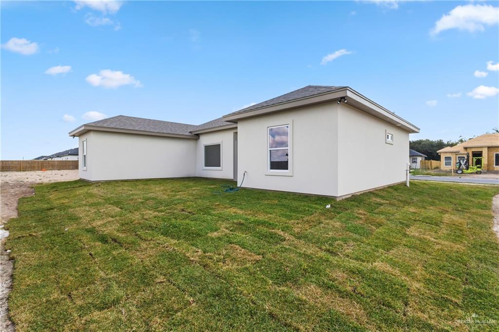 1921 Trinity Street Donna, TX 78537 - Photo 17 of 18 a view of a backyard with large trees
