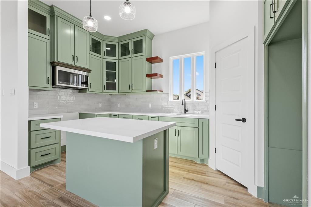 1921 Trinity Street Donna, TX 78537 - Photo 4 of 18 a kitchen with a sink and a refrigerator