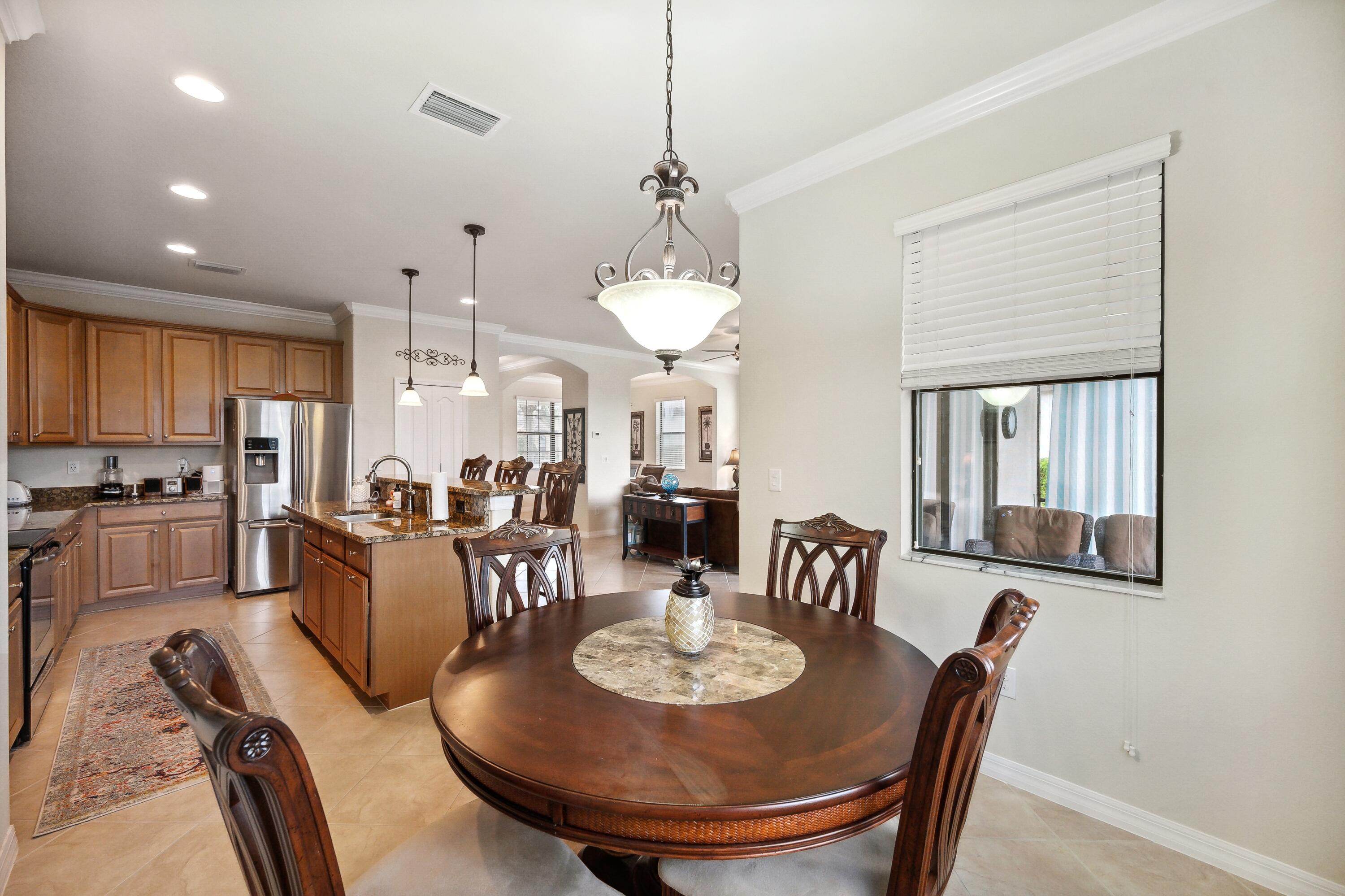 3833 Ruby Way Naples, FL 34114 - Photo 12 of 31 a view of a dining room with furniture