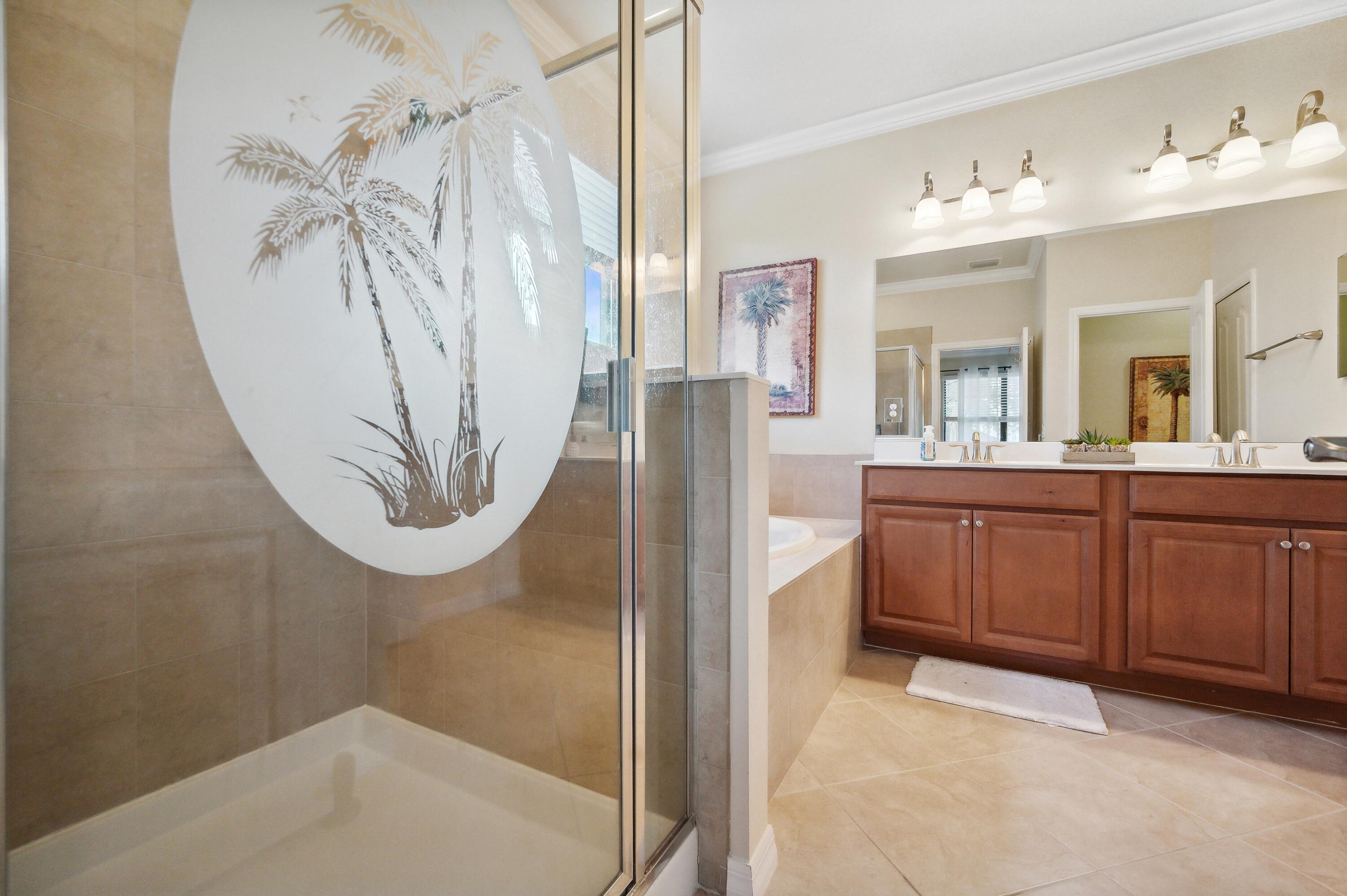 3833 Ruby Way Naples, FL 34114 - Photo 18 of 31 a bathroom with a sink a mirror and a shower