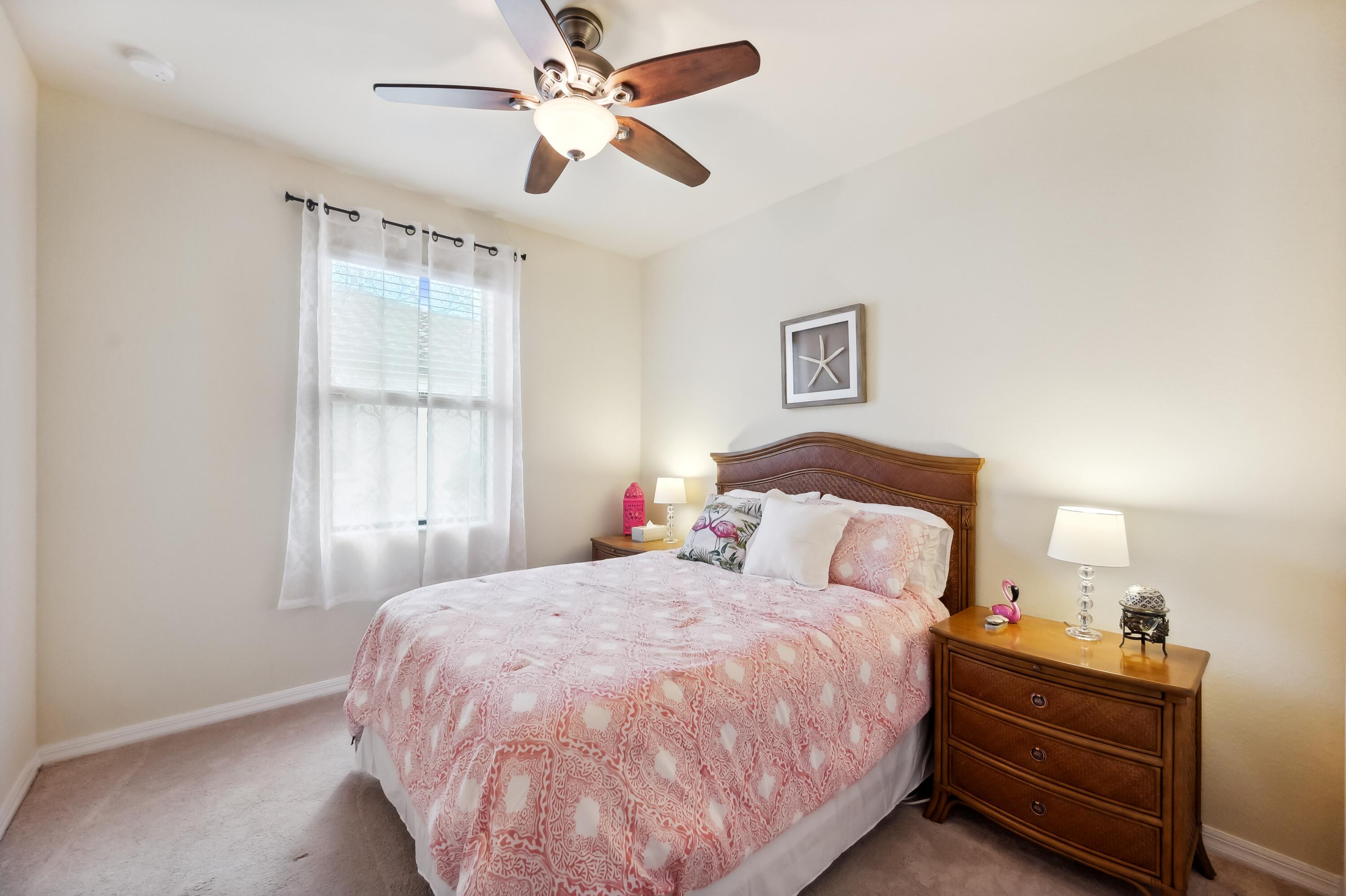 3833 Ruby Way Naples, FL 34114 - Photo 20 of 31 a bedroom with a bed and a window