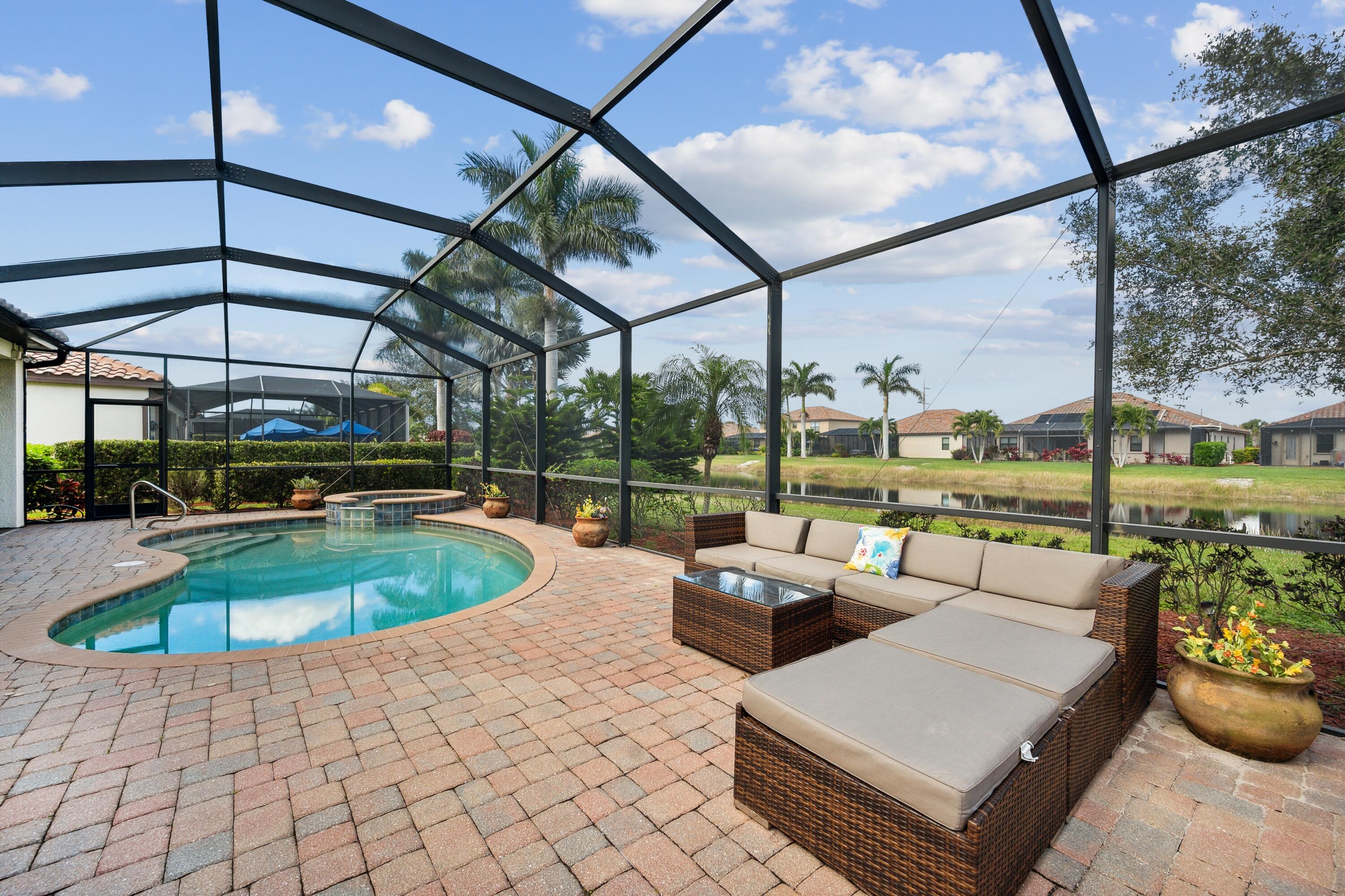 3833 Ruby Way Naples, FL 34114 - Photo 27 of 31 a view of a patio with swimming pool