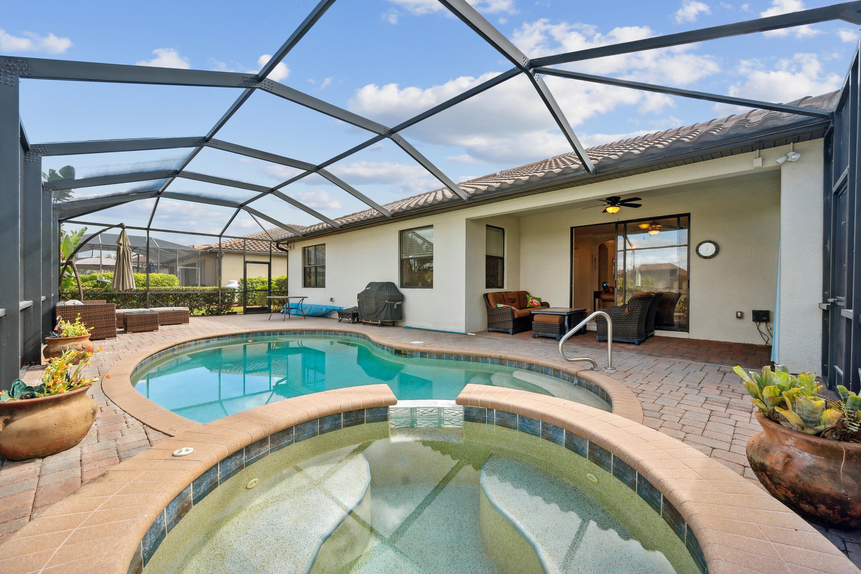 3833 Ruby Way Naples, FL 34114 - Photo 29 of 31 a swimming pool with outdoor seating