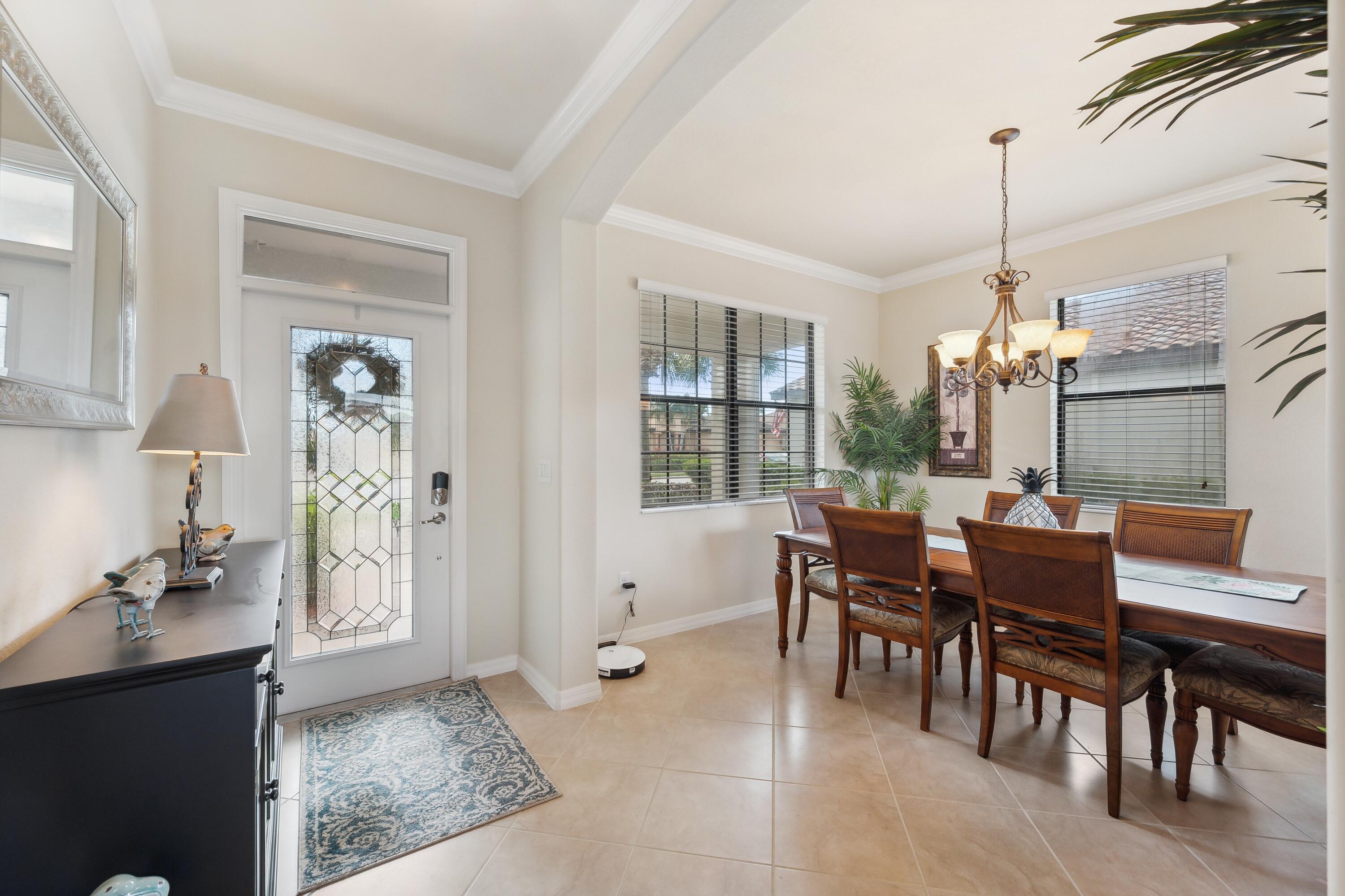 3833 Ruby Way Naples, FL 34114 - Photo 3 of 31 a view of a dining room with furniture and window