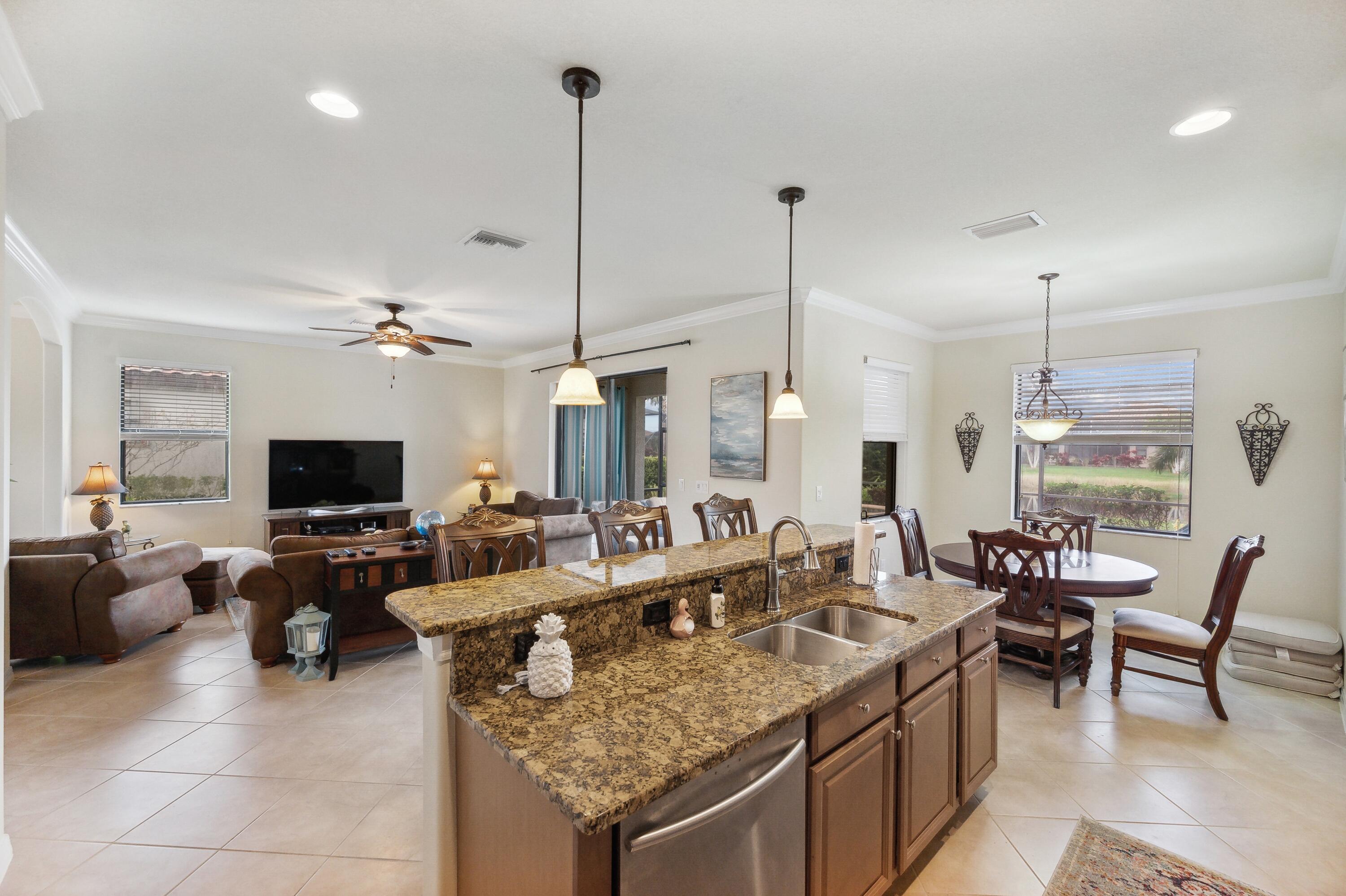 3833 Ruby Way Naples, FL 34114 - Photo 9 of 31 a living room with furniture and a flat screen tv