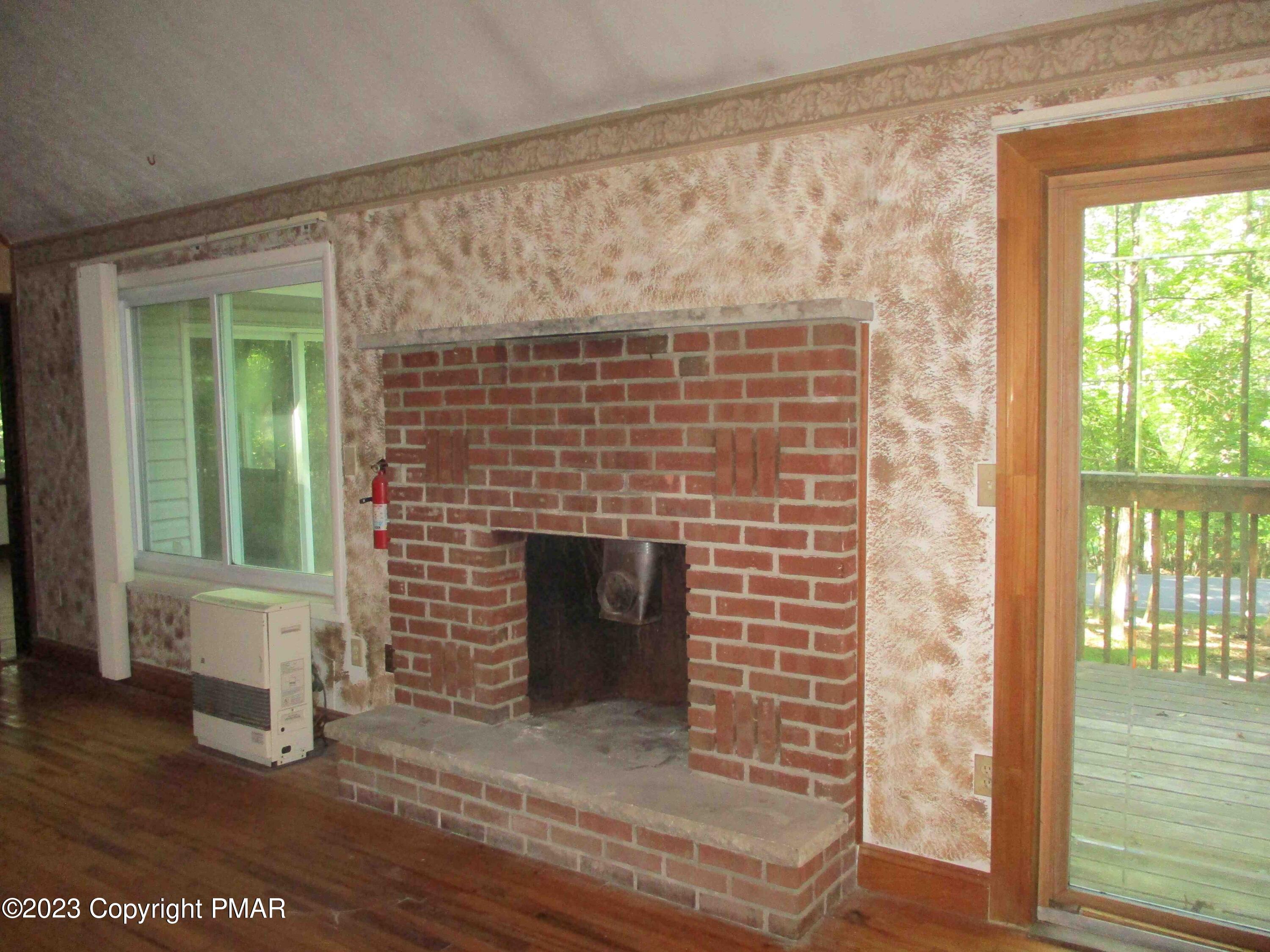 5695 Decker Road Bushkill, PA 18324 - Photo 3 of 9 a front view of a house with garden