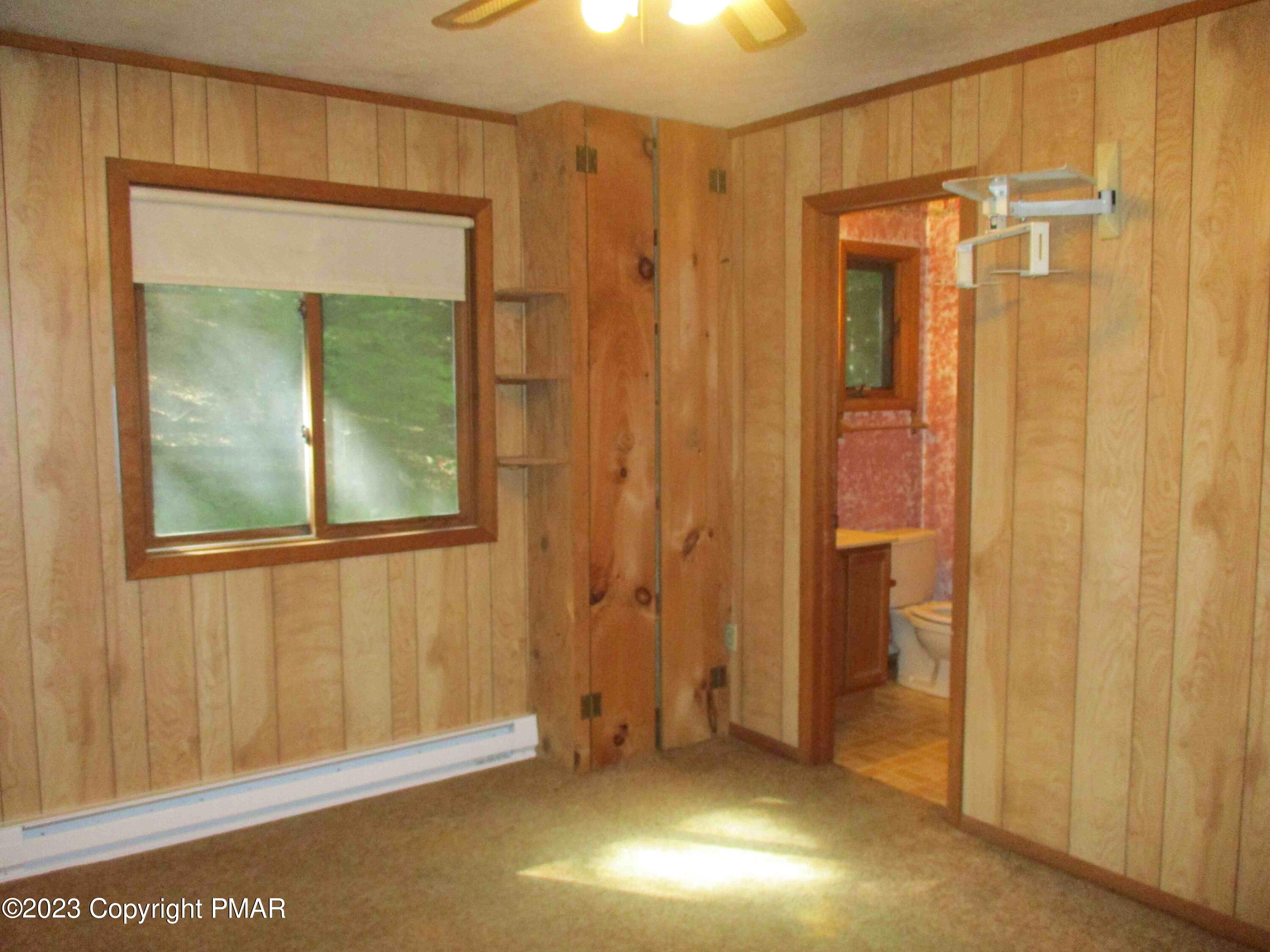 5695 Decker Road Bushkill, PA 18324 - Photo 4 of 9 a view of an empty room with a window