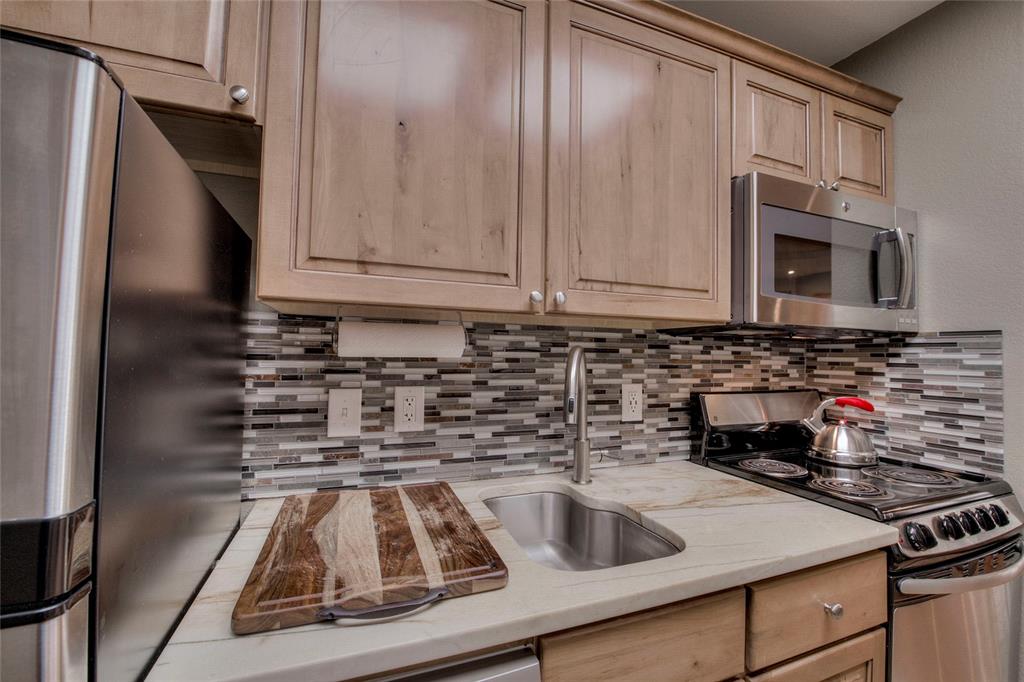 655 4 O Clock Road, Unit 108 Breckenridge, CO 80424 - Photo 11 of 20 a kitchen with stainless steel appliances granite countertop a sink stove and refrigerator