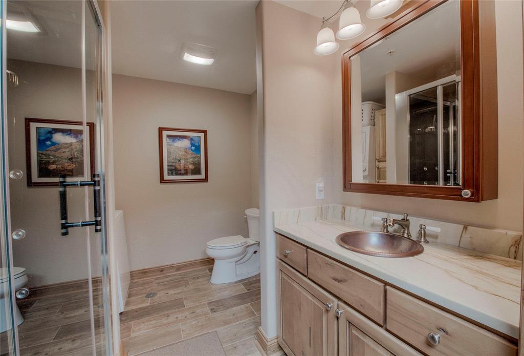 655 4 O Clock Road, Unit 108 Breckenridge, CO 80424 - Photo 12 of 20 a bathroom with a sink toilet and shower