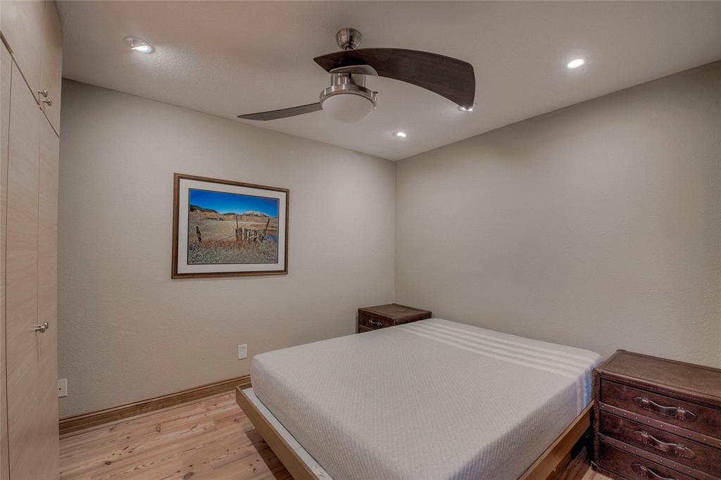 655 4 O Clock Road, Unit 108 Breckenridge, CO 80424 - Photo 16 of 20 a bedroom with a bed and a ceiling fan
