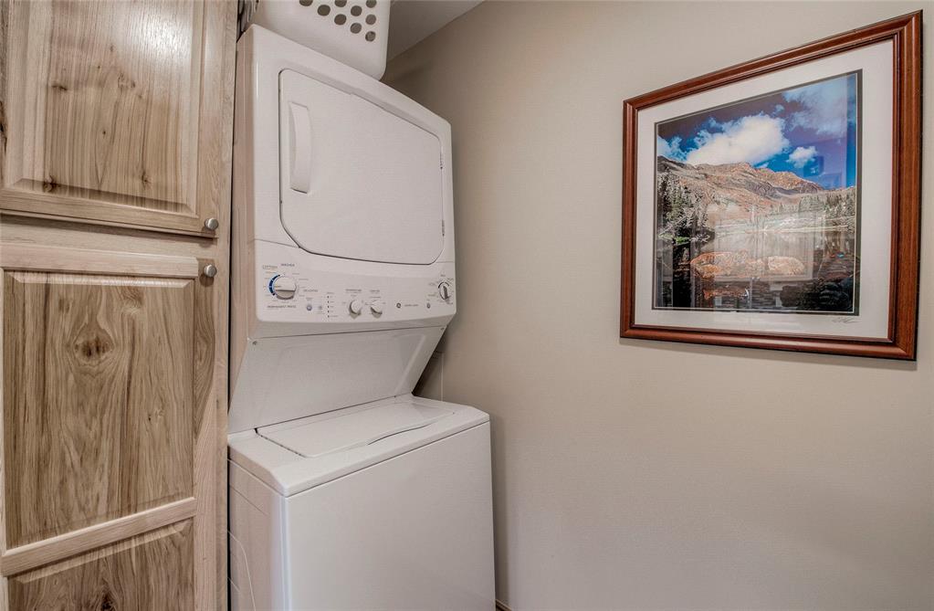 655 4 O Clock Road, Unit 108 Breckenridge, CO 80424 - Photo 17 of 20 a view of a hallway with washer and dryer