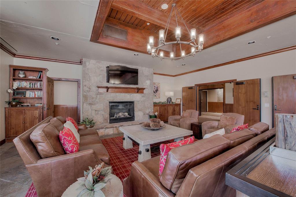 655 4 O Clock Road, Unit 108 Breckenridge, CO 80424 - Photo 19 of 20 a living room with furniture and a fireplace