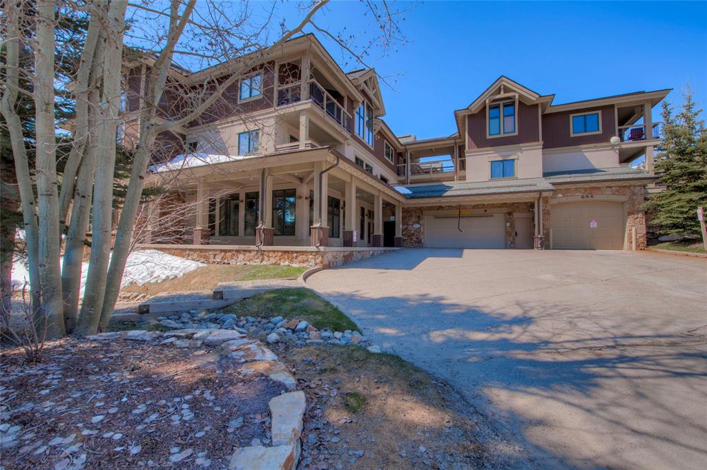 655 4 O Clock Road, Unit 108 Breckenridge, CO 80424 - Photo 2 of 20 a front view of a building with a yard