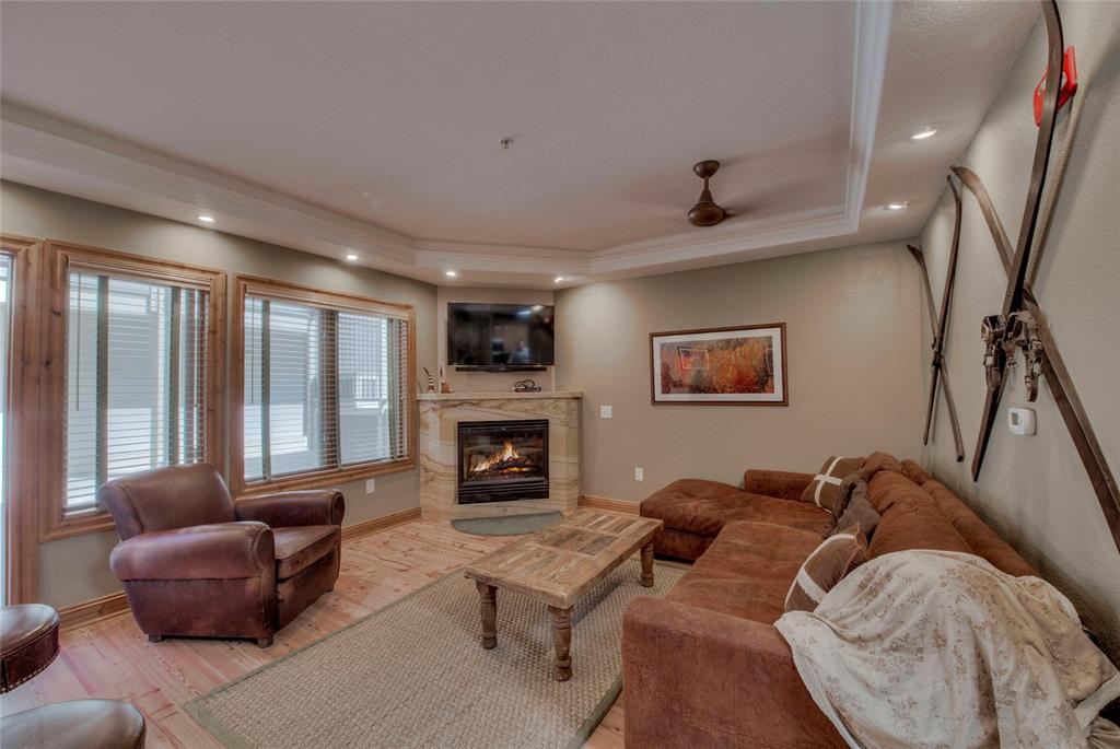 655 4 O Clock Road, Unit 108 Breckenridge, CO 80424 - Photo 5 of 20 a living room with furniture and a fireplace