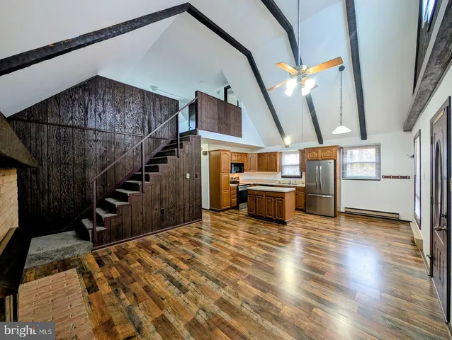 a view of a livingroom with wooden floor