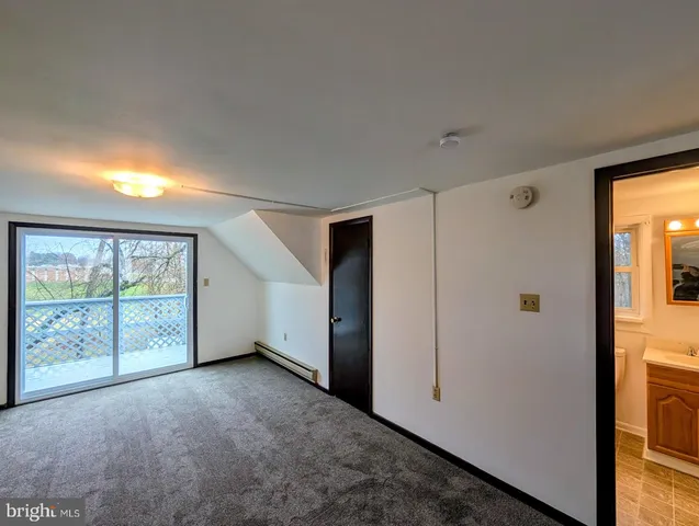 a kitchen with a refrigerator a stove top oven a sink and cabinets