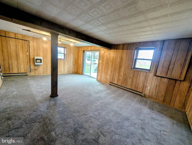 a view of an empty room with a fireplace