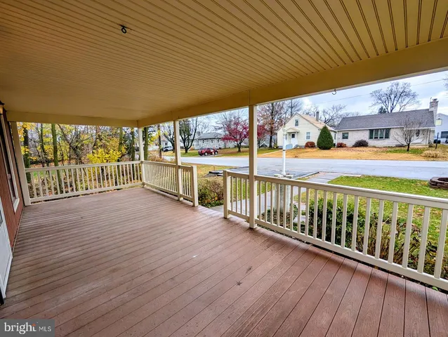a view of a yard in front of a brick house