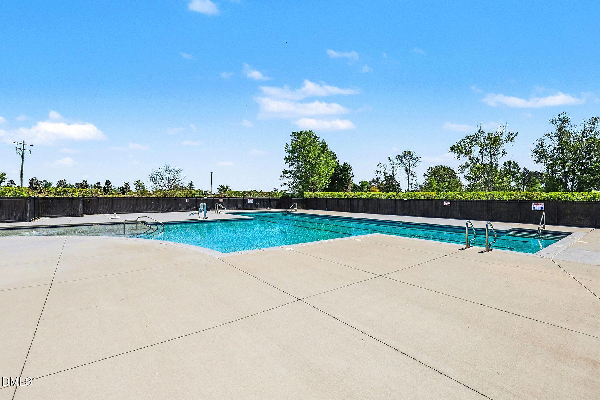 90 Rigsby Avenue Four Oaks, NC 27524 - Photo 40 of 43 a view of a lake with outdoor space