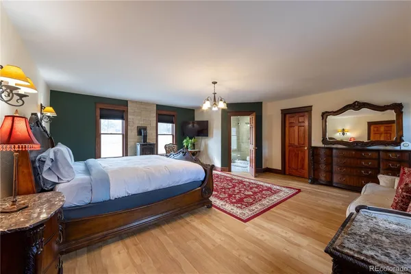 a living room with furniture fireplace and a table