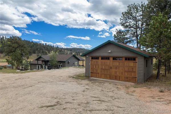 a kitchen with stainless steel appliances granite countertop a refrigerator and a stove