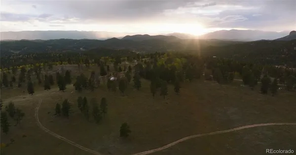 a view of a lake with lots of trees