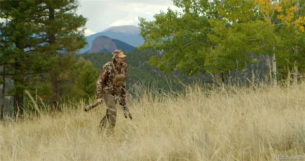 a swimming pool with outdoor seating and yard