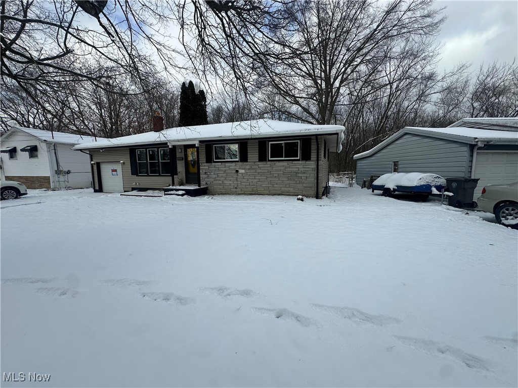 603 Liberty Road Youngstown, OH 44505 - Photo 2 of 42 Ranch-style home with stone siding and a garage