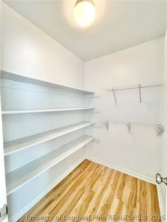 a view of a room with shelf on the wall