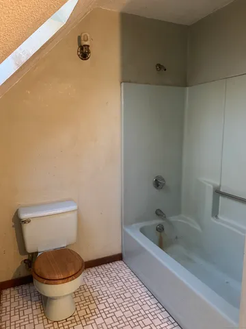 a house with trees in the background