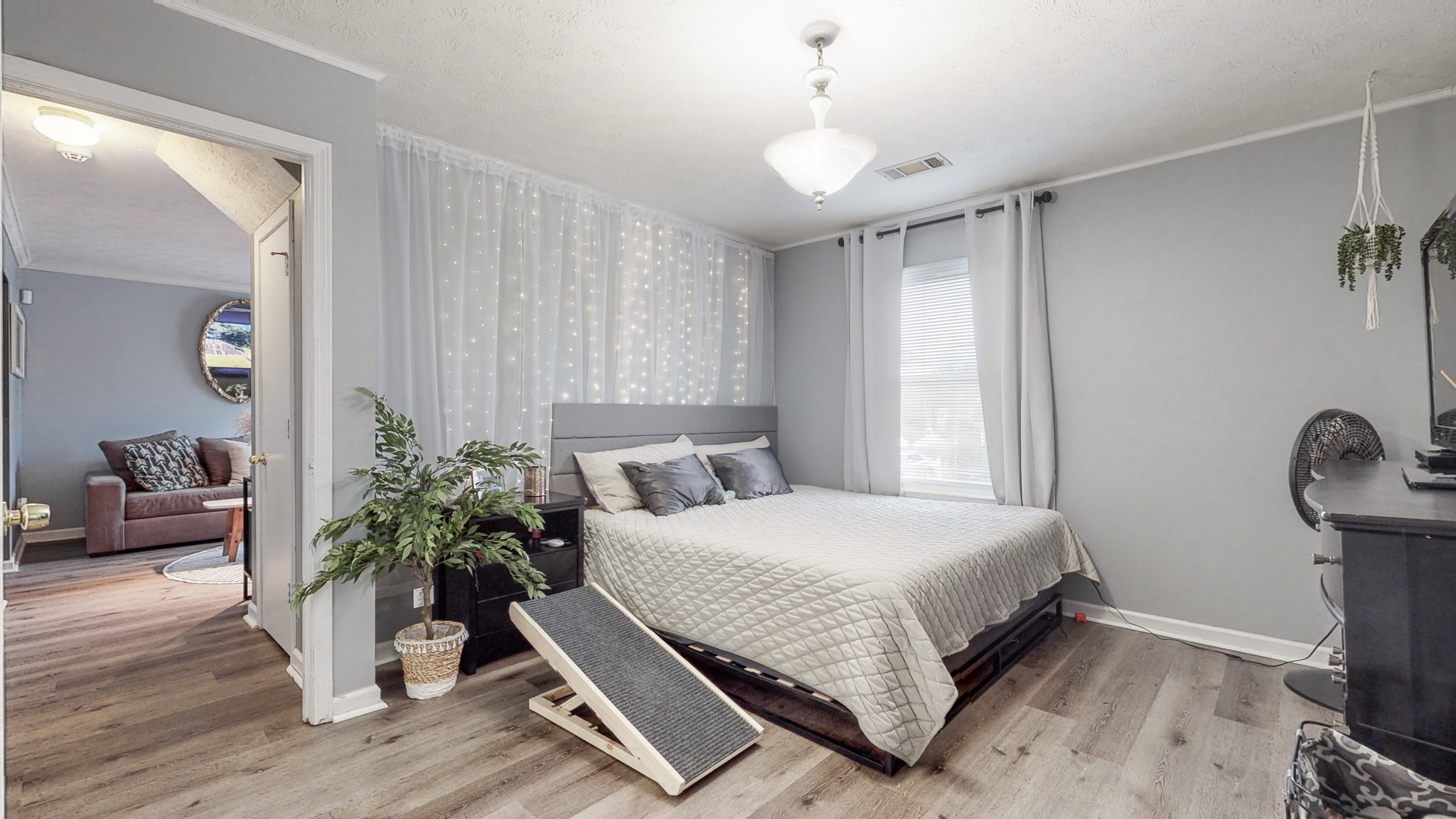 209 Dockside Court Hermitage, TN 37076 - Photo 11 of 43 a bedroom with a bed and a potted plant