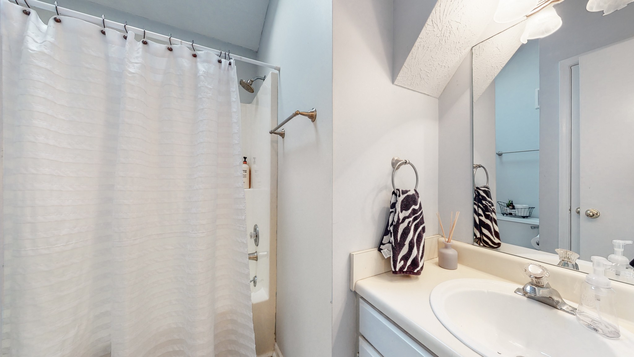 209 Dockside Court Hermitage, TN 37076 - Photo 19 of 43 a bathroom with a sink and a mirror