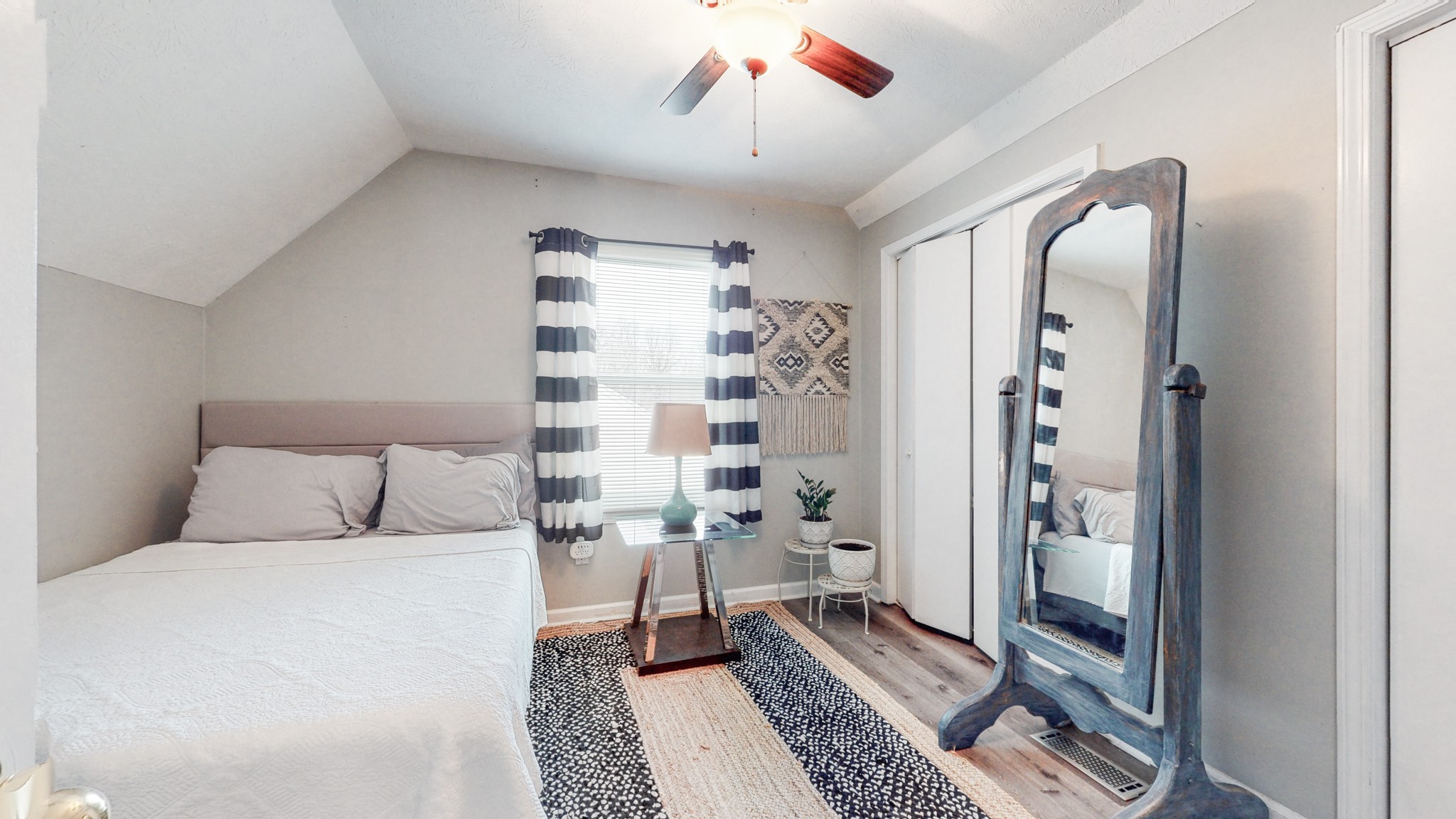 209 Dockside Court Hermitage, TN 37076 - Photo 20 of 43 a bed room with a bed and a chandelier
